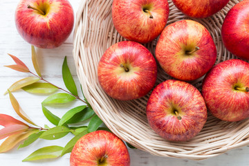 Red apple on rustic wooden table background