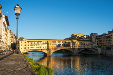 Fototapeta premium Ponte Vecchio, view from the embankment of Arno river