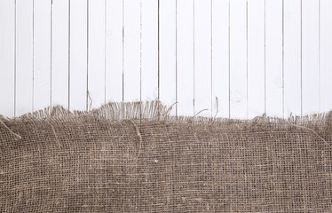 White wood background with burlap