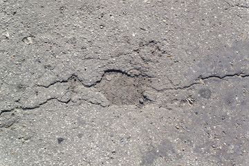 Obraz premium Texture of the old road with cracks