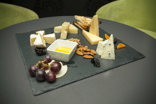 different types of cheeses with dried fruits