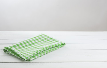 Table with green tablecloth for product montage