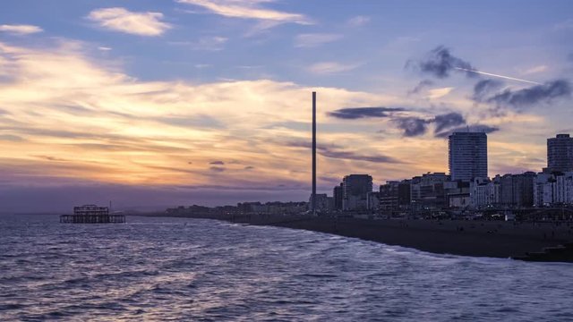 Time lapse view of a sunset on the beach in Brighton. Day to night transition