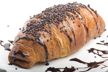 croissants with chocolate on a white plate