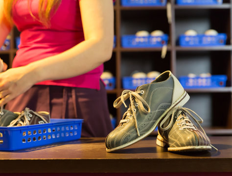 Bowling shoes and pins