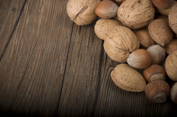 Fresh group of nuts  on the wooden table