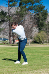 golfer playing a shot on the fairway