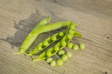 pea pods on wooden table