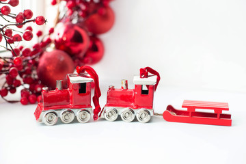 Beautiful red Christmas toys on a white background. Amazing Chri