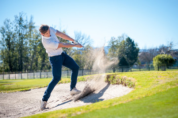 golfer playing a chip shot onto the green