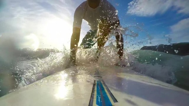 surfing in slow motion at sunset