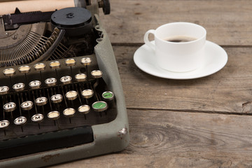 Obraz na płótnie Canvas Vintage typewriter on the old wooden desk