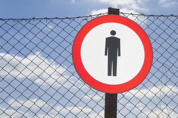 No Entry Sign on a Fence