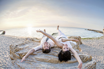 A loving couple fooling around on the sea