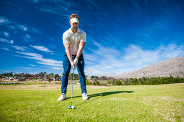 golfer playing a shot on the fairway