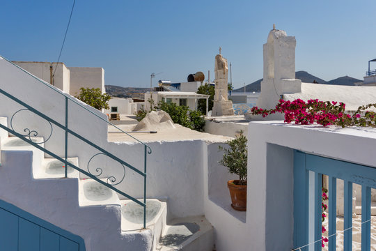 Small white church with flowers in town of Parakia, Paros island, Cyclades, Greece