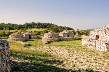 reconstruction village Paleolithic in Abruzzo (Italy) - obrazy, fototapety, plakaty