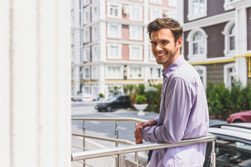 Happy businessman enjoying urban view