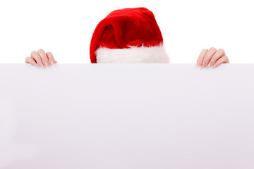 Woman peeking over empty banner board. Christmas