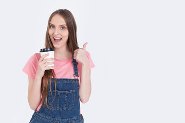 Fototapeta premium Smiling girl with coffee cup