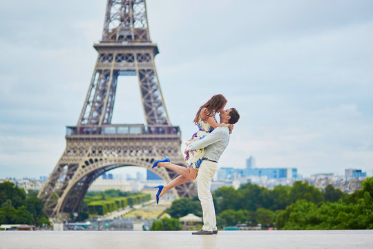 Romantic loving couple having a date near the Eiffel tower
