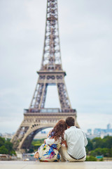 Fototapeta na wymiar Romantic loving couple having a date near the Eiffel tower