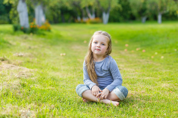 Portrait of a cute girl with long blond hair