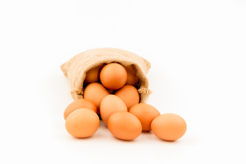 Eggs wrapped in sackcloth isolated on white background