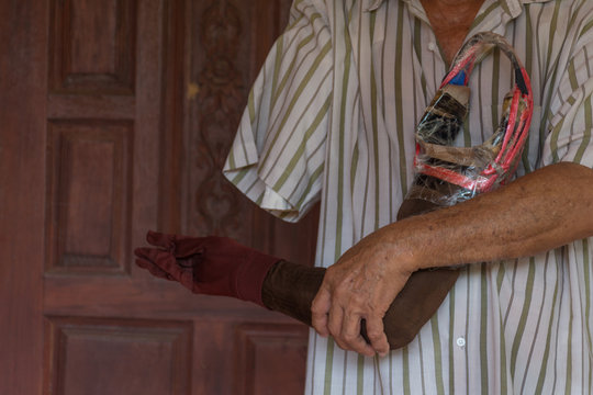 Asia elderly man with one arm and arm prosthetic