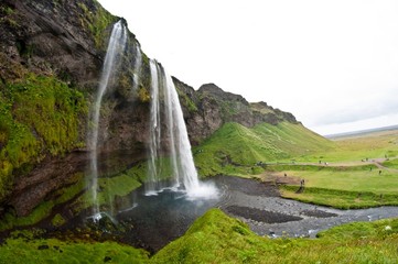 Fototapeta premium famous Seljalandsfoss waterfall, popular tourist spot in Iceland