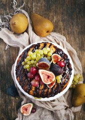 Chocolate coffee cake decorated fresh fruits