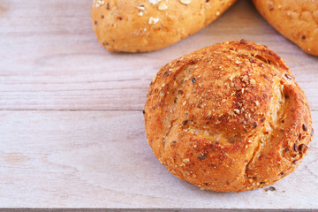 Close up of multi grain bread on a wooden table.