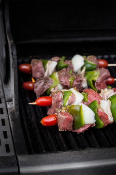 Beef kebabs grilling on the barbecue 