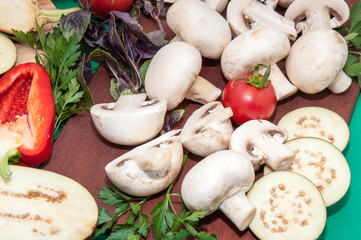 Champignon and fresh vegetables on a kitchen table