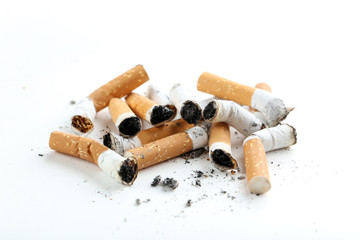 Cigarette butts with ash isolated on a white