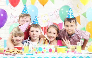 Happy kids having fun at birthday party