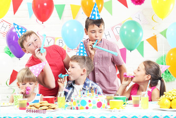 Happy kids having fun at birthday party