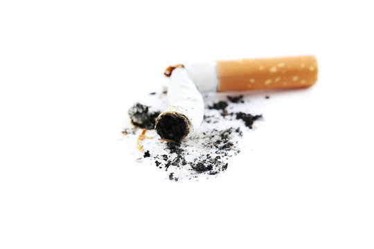 Cigarette butt with ash isolated on a white