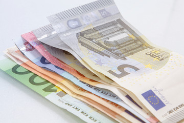 Euro banknotes stacked by value.