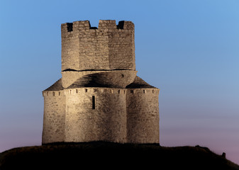 Old small stone church of St. Nicholas on hill near city of  Nin in Croatia.