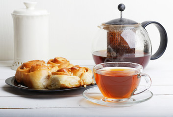 Tea and pastry on white wooden table