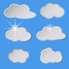 Fototapeta premium Stylized white clouds in the blue sky, the sun.