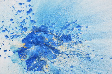color powder spread on white paper