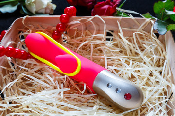 Pink vibrator with beads and roses