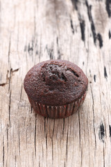 Banana cupcakes on wooden floor.