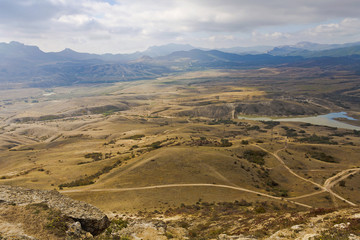 Fototapeta na wymiar Top view of Armutluk the valley with lake, hills and ravines.Crimea.