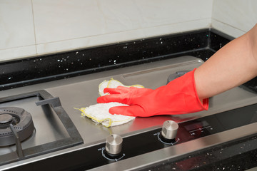 cleaning gas stove at kitchen
