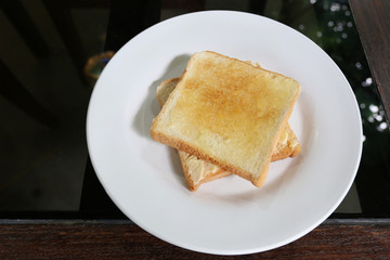 Fototapeta na wymiar baked bread on white dish.