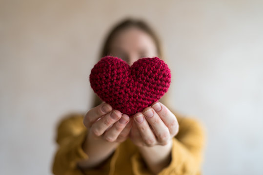 Woman with a crocheted heart