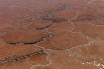 Pool of pink salt water for salt production.